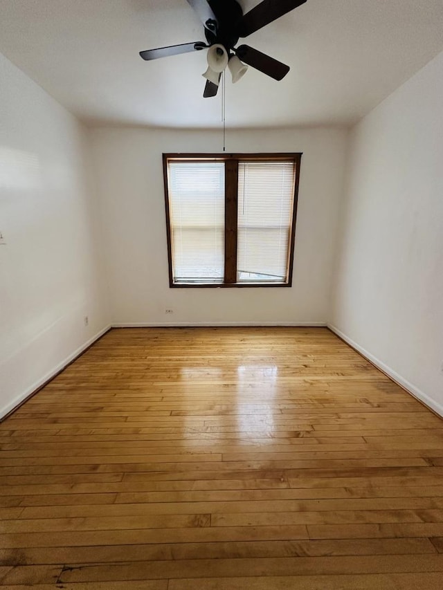 unfurnished room with ceiling fan and light wood-type flooring