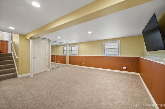 basement featuring recessed lighting, stairway, carpet floors, and baseboards