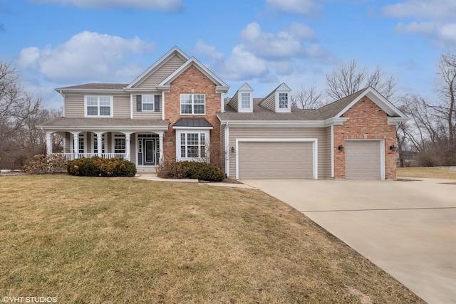 view of front of house featuring a garage, a front lawn, and a porch