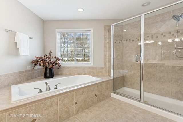 bathroom with tile patterned floors and independent shower and bath