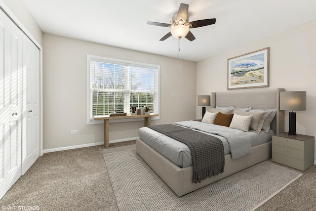 carpeted bedroom featuring ceiling fan and a closet