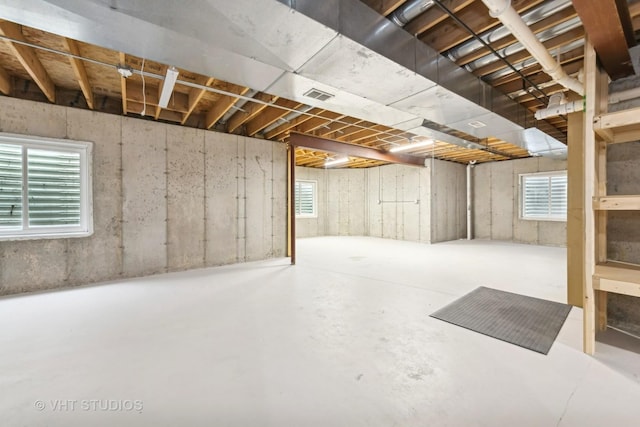 basement featuring plenty of natural light