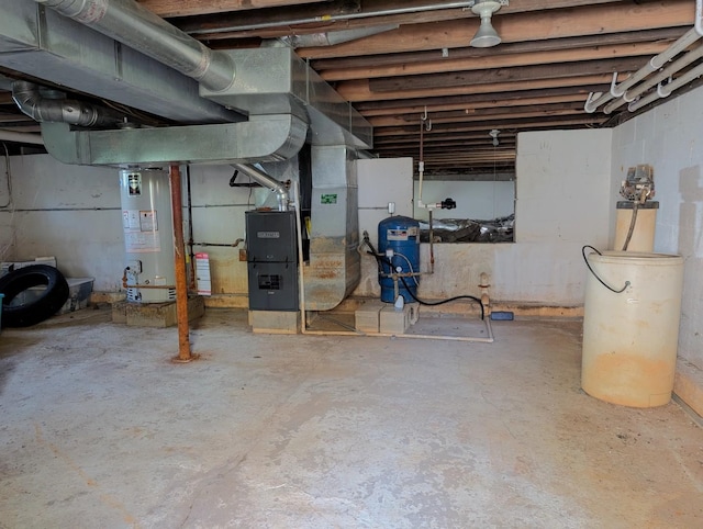 basement featuring water heater and heating unit