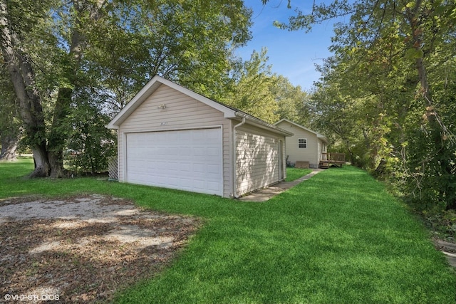 garage featuring a yard