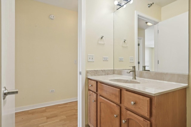 bathroom with wood-type flooring and vanity