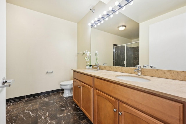 bathroom with toilet, a shower with door, and vanity