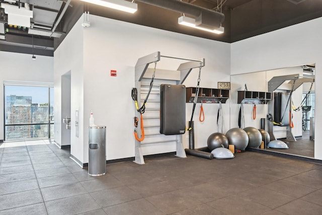 workout area featuring a high ceiling