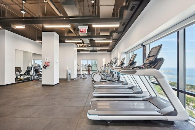 workout area with a high ceiling