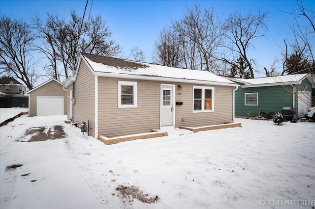 bungalow-style home with an outbuilding and a garage