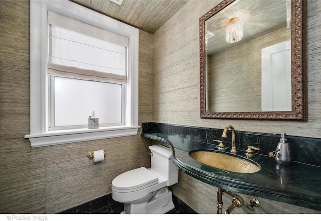 bathroom featuring tile patterned flooring, sink, and toilet