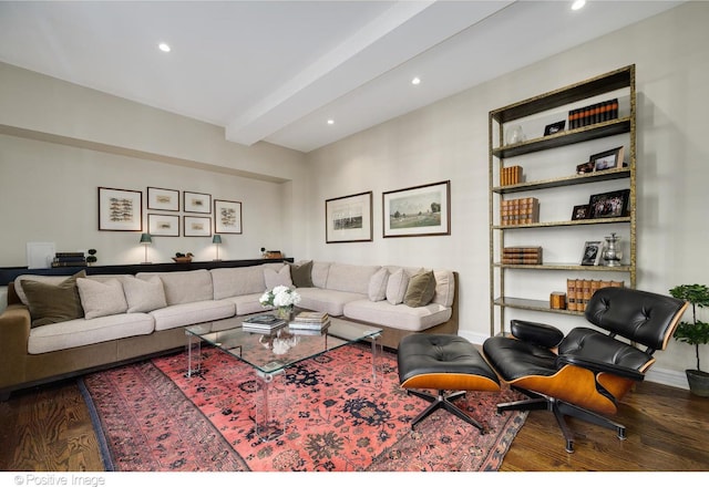 living room featuring dark wood-type flooring and beamed ceiling