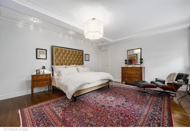 bedroom featuring ornamental molding and dark hardwood / wood-style flooring