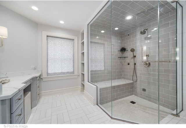 bathroom featuring vanity and walk in shower