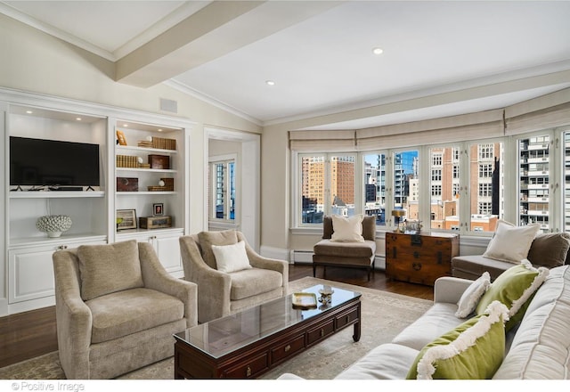 living room with hardwood / wood-style floors, built in features, lofted ceiling with beams, baseboard heating, and crown molding