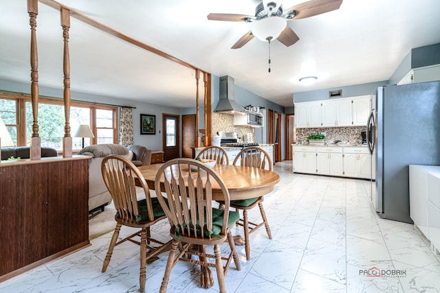 dining room featuring ceiling fan