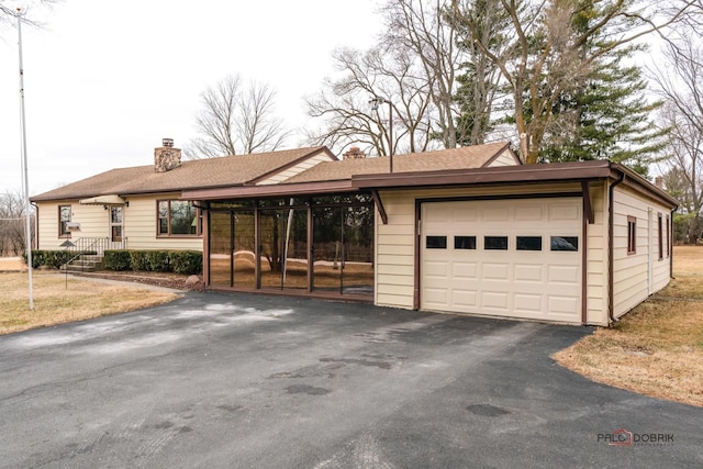 ranch-style home featuring a garage