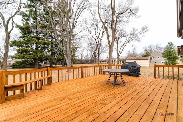 wooden deck with a storage shed