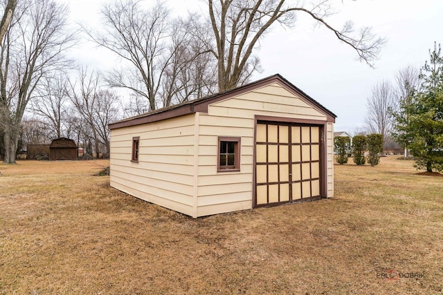 view of outdoor structure featuring a yard