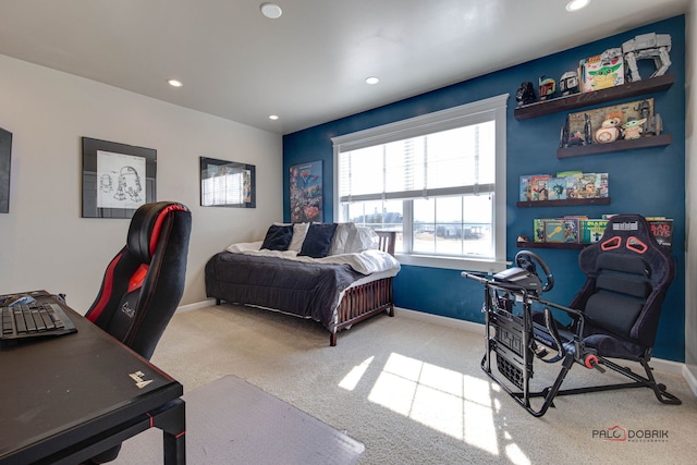 carpeted bedroom featuring baseboards and recessed lighting