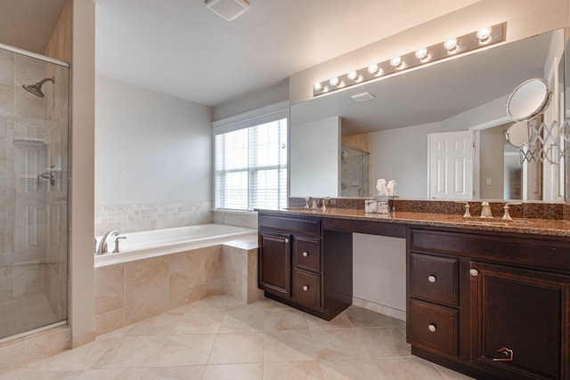 bathroom featuring visible vents, a sink, a shower stall, and a garden tub