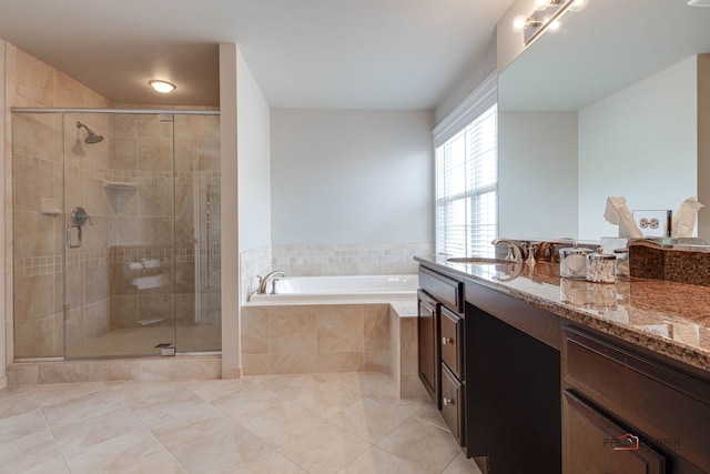 full bathroom featuring a garden tub, tile patterned flooring, a shower stall, and vanity