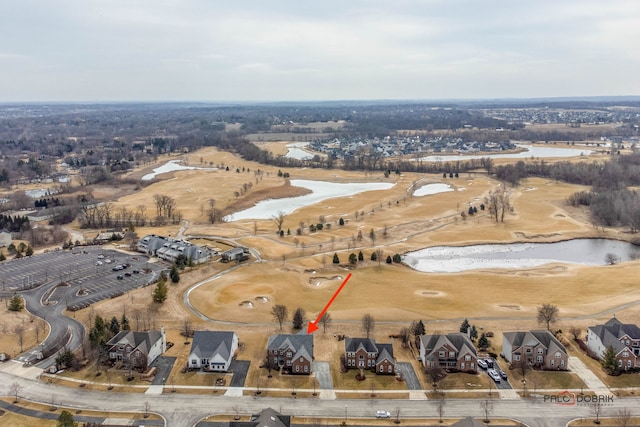 birds eye view of property with a water view and a residential view