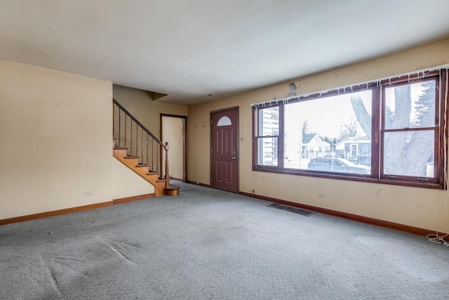 view of carpeted entrance foyer