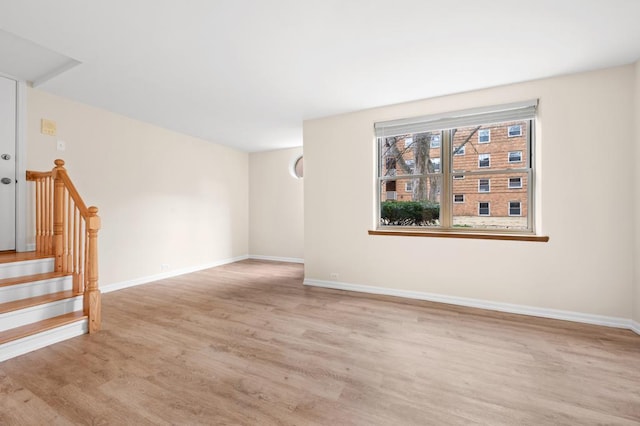 spare room featuring light wood-type flooring