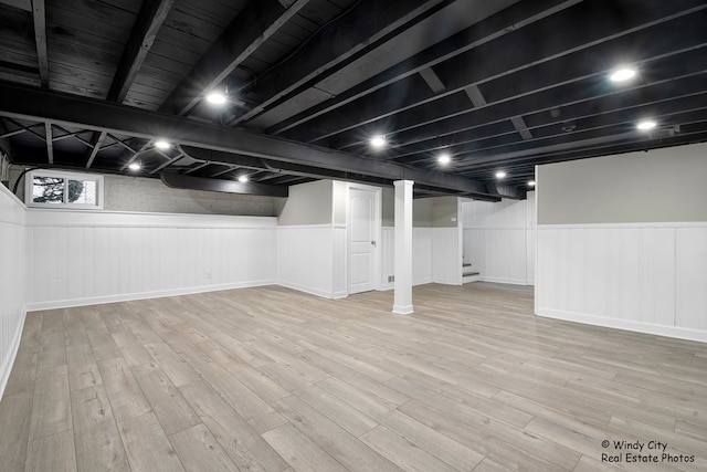 basement featuring light hardwood / wood-style flooring