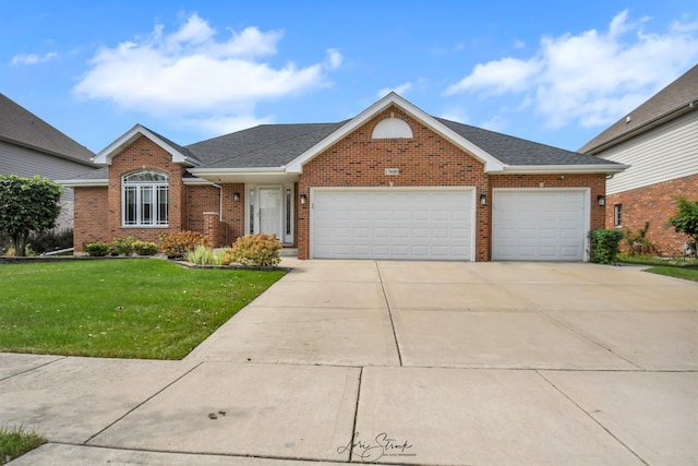 ranch-style home featuring a garage and a front yard