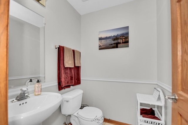 bathroom with sink and toilet