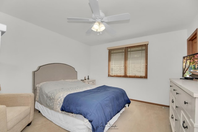 bedroom featuring ceiling fan and light colored carpet