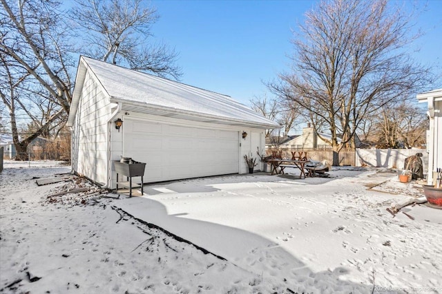 view of snow covered garage