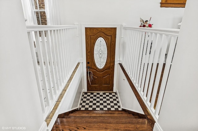 entrance foyer with dark floors