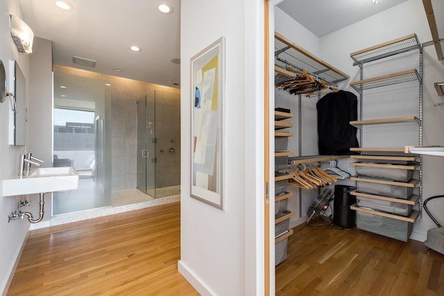 walk in closet featuring wood-type flooring