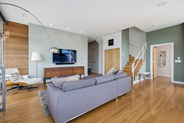 living room with light hardwood / wood-style flooring