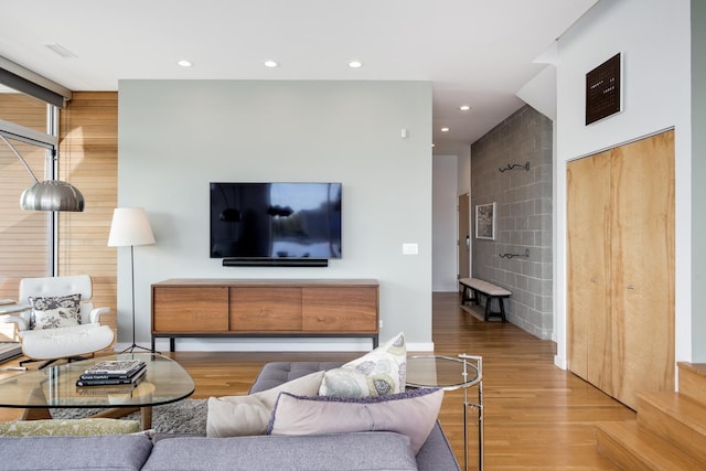 living room with light hardwood / wood-style flooring