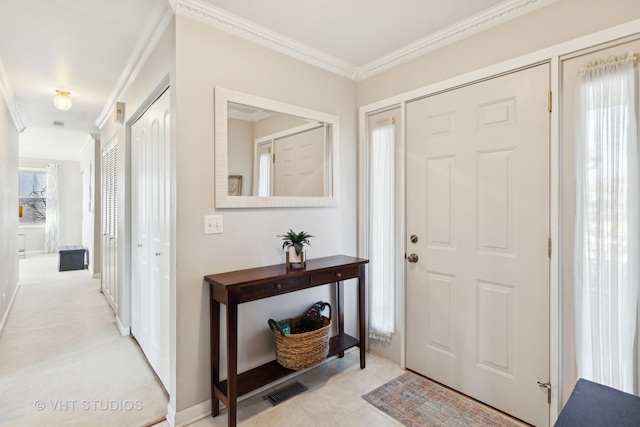 entryway featuring ornamental molding