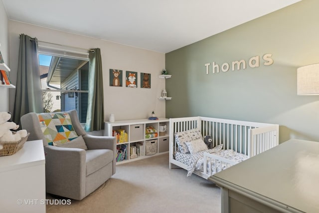 bedroom with light carpet and a crib