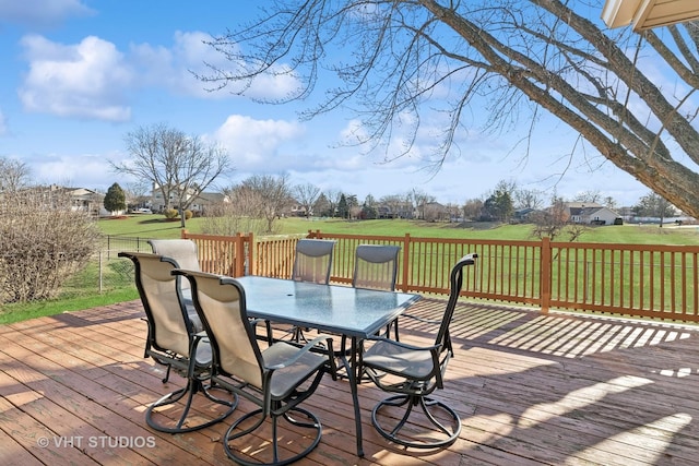 wooden deck featuring a yard