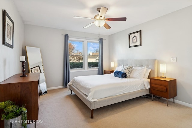 bedroom featuring ceiling fan and light colored carpet