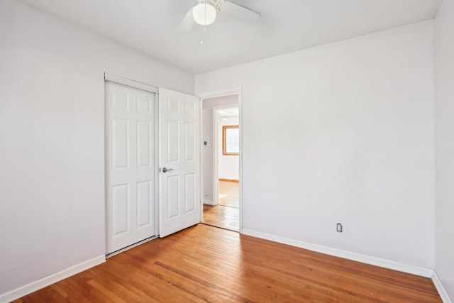 unfurnished bedroom featuring ceiling fan and light hardwood / wood-style floors