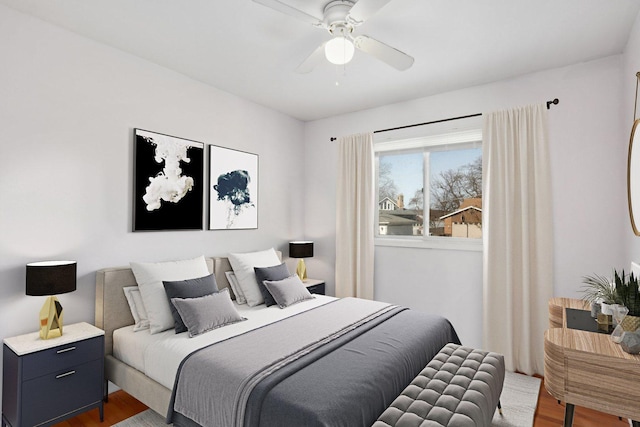 bedroom with hardwood / wood-style floors and ceiling fan