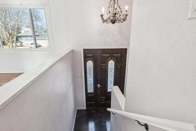 foyer featuring an inviting chandelier