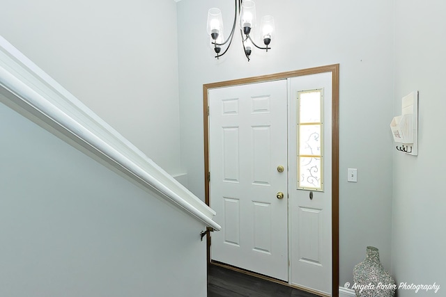 entrance foyer featuring an inviting chandelier