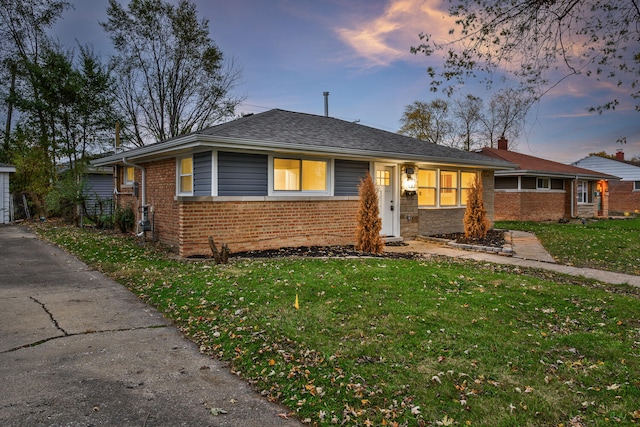 ranch-style house with a yard