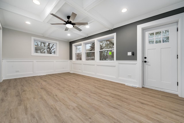 foyer entrance featuring coffered ceiling, ceiling fan, ornamental molding, beam ceiling, and light hardwood / wood-style flooring