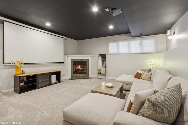 cinema room with light carpet and a fireplace