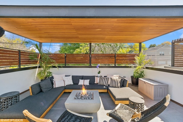 view of patio / terrace with an outdoor living space with a fire pit