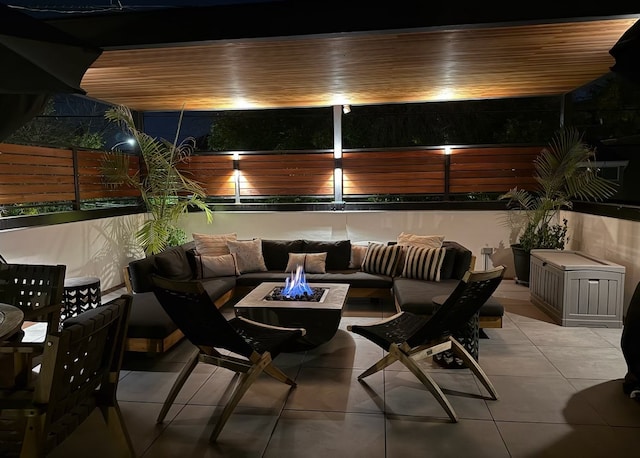 view of patio featuring an outdoor living space with a fire pit